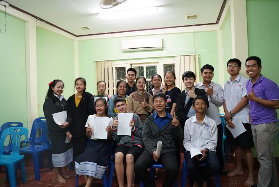 A teache with his students on Graduation Day