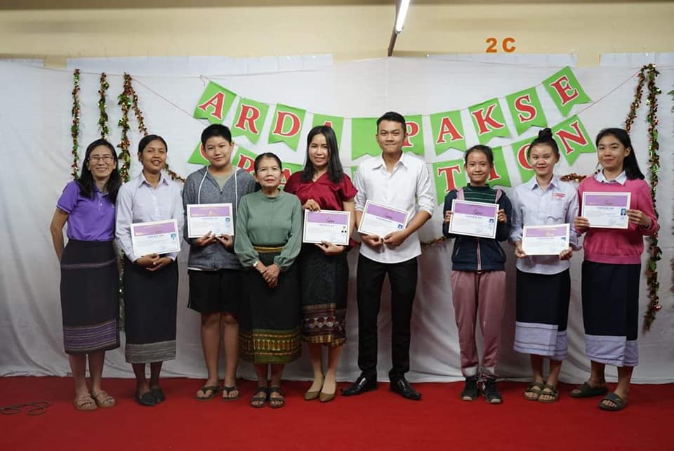 Receiving certificates on Graduation Day